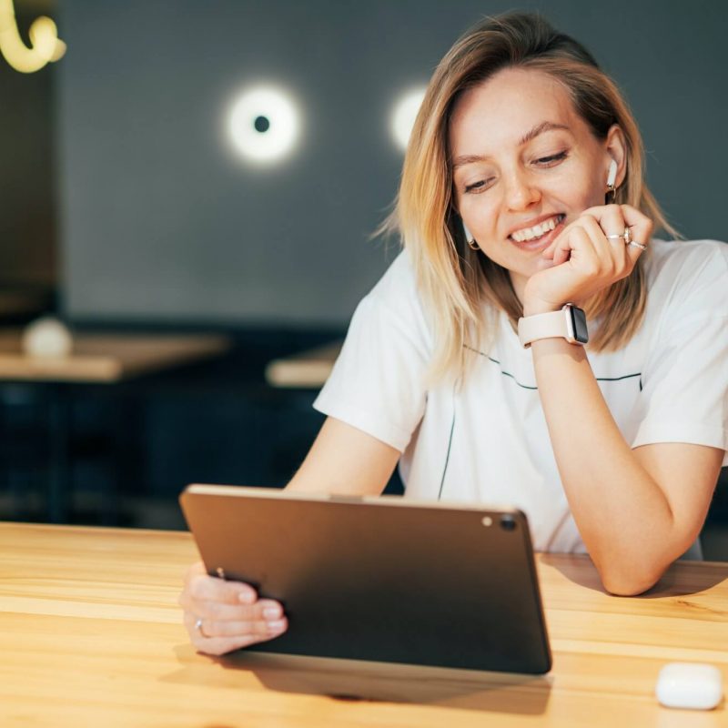 stylish-millennial-woman-working-on-tablet-in-coworking-space-1-1.jpg